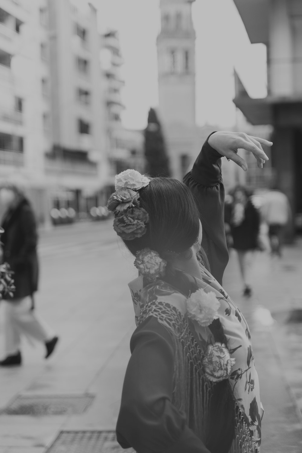 a black and white photo of a woman in a kimono