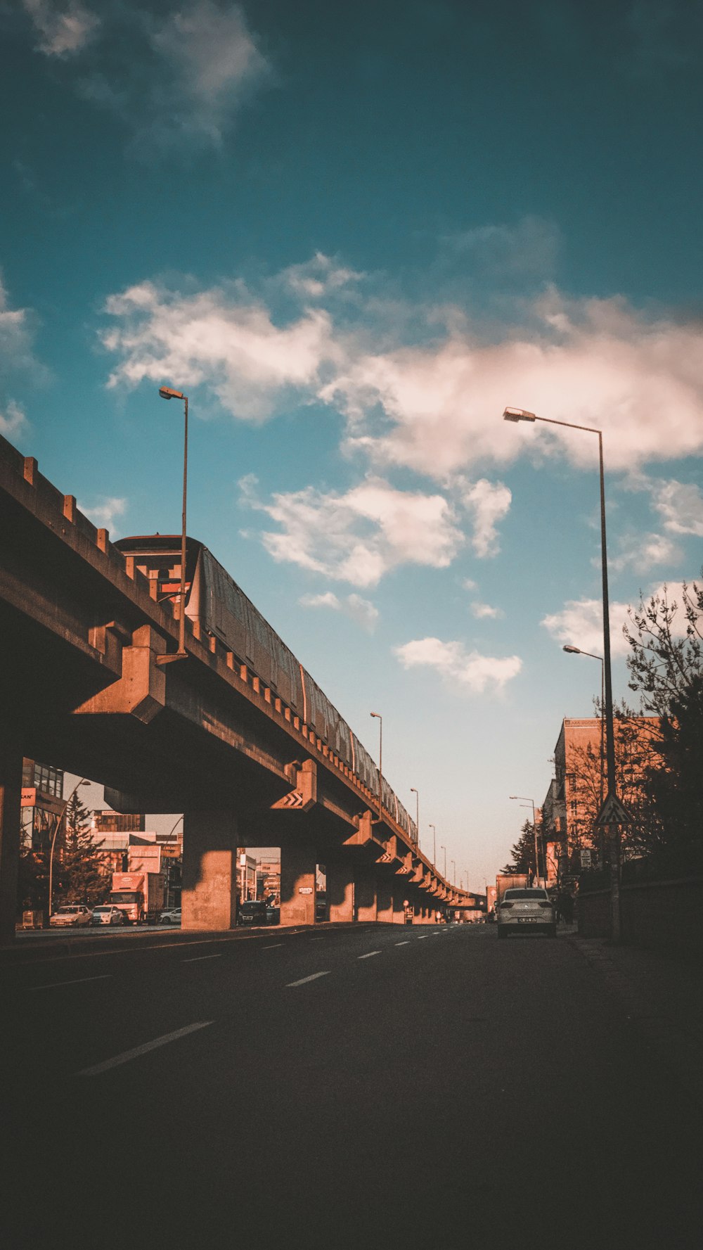 a view of a highway with a bridge in the background