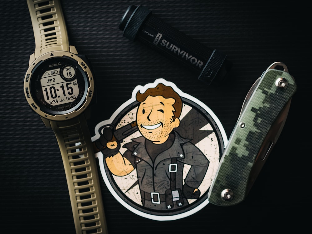 a watch and a sticker with a picture of a man