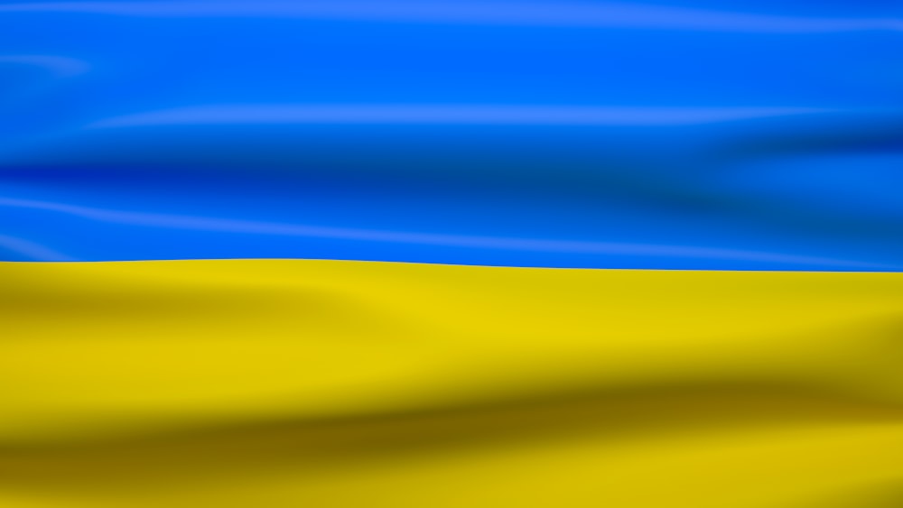 the flag of ukraine is waving in the wind