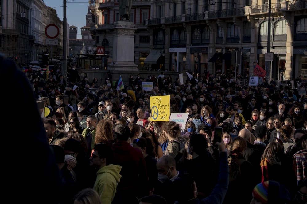 a large group of people standing in the street