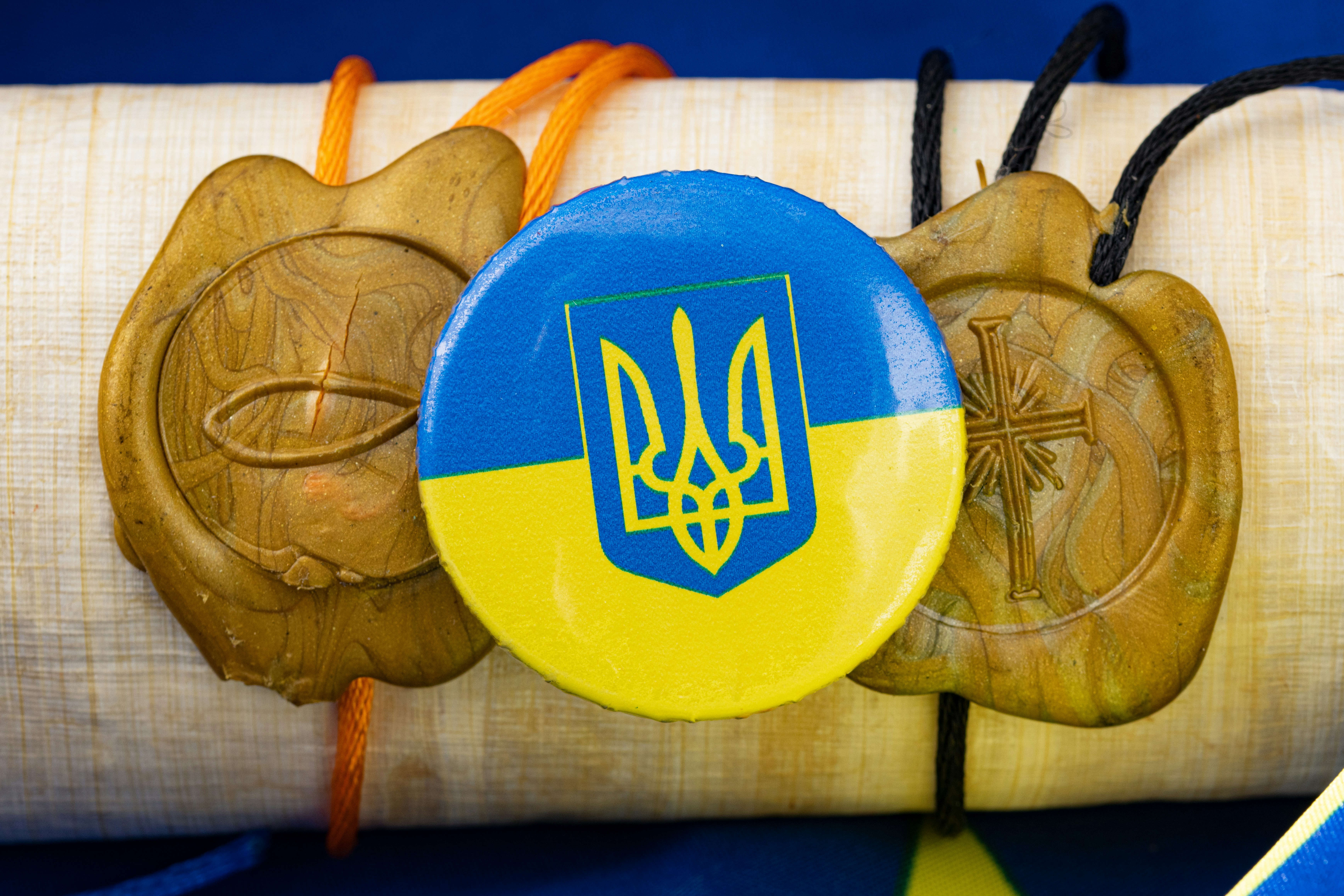 a close up of a wooden object with a flag on it