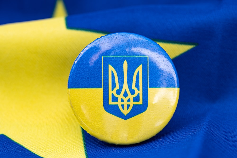 a button with a flag of ukraine on it