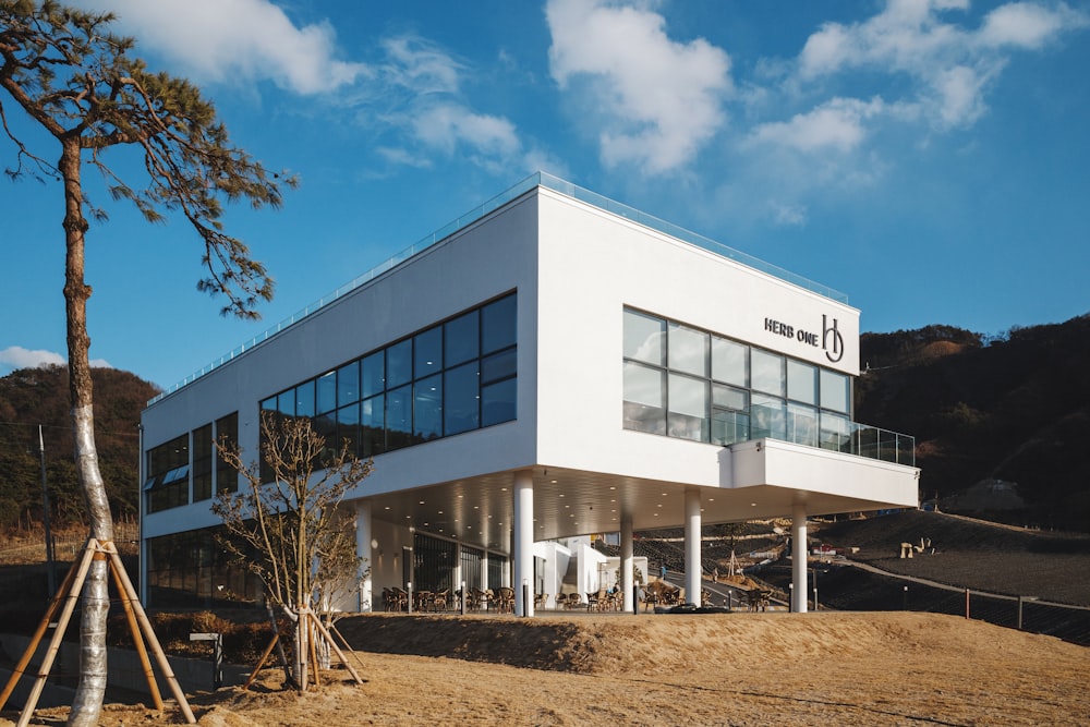 a large white building sitting on top of a hill