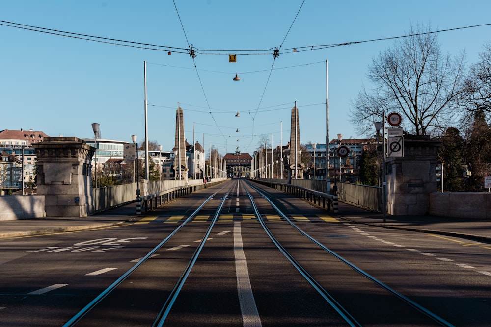 a train track crossing over a bridge in a city