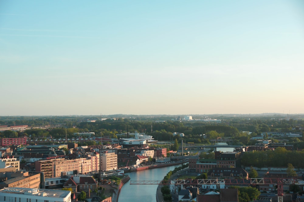 a river running through a city next to tall buildings