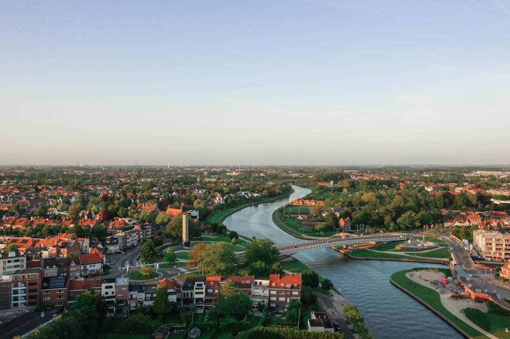 an aerial view of a river running through a city