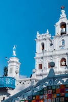 a large white building with a clock tower