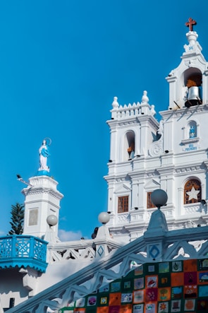 a large white building with a clock tower