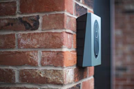 a close up of a brick wall with a speaker on it