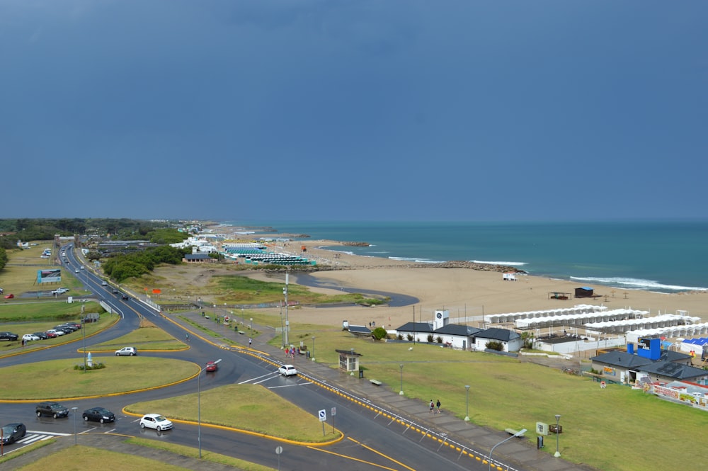 an aerial view of a parking lot and a beach