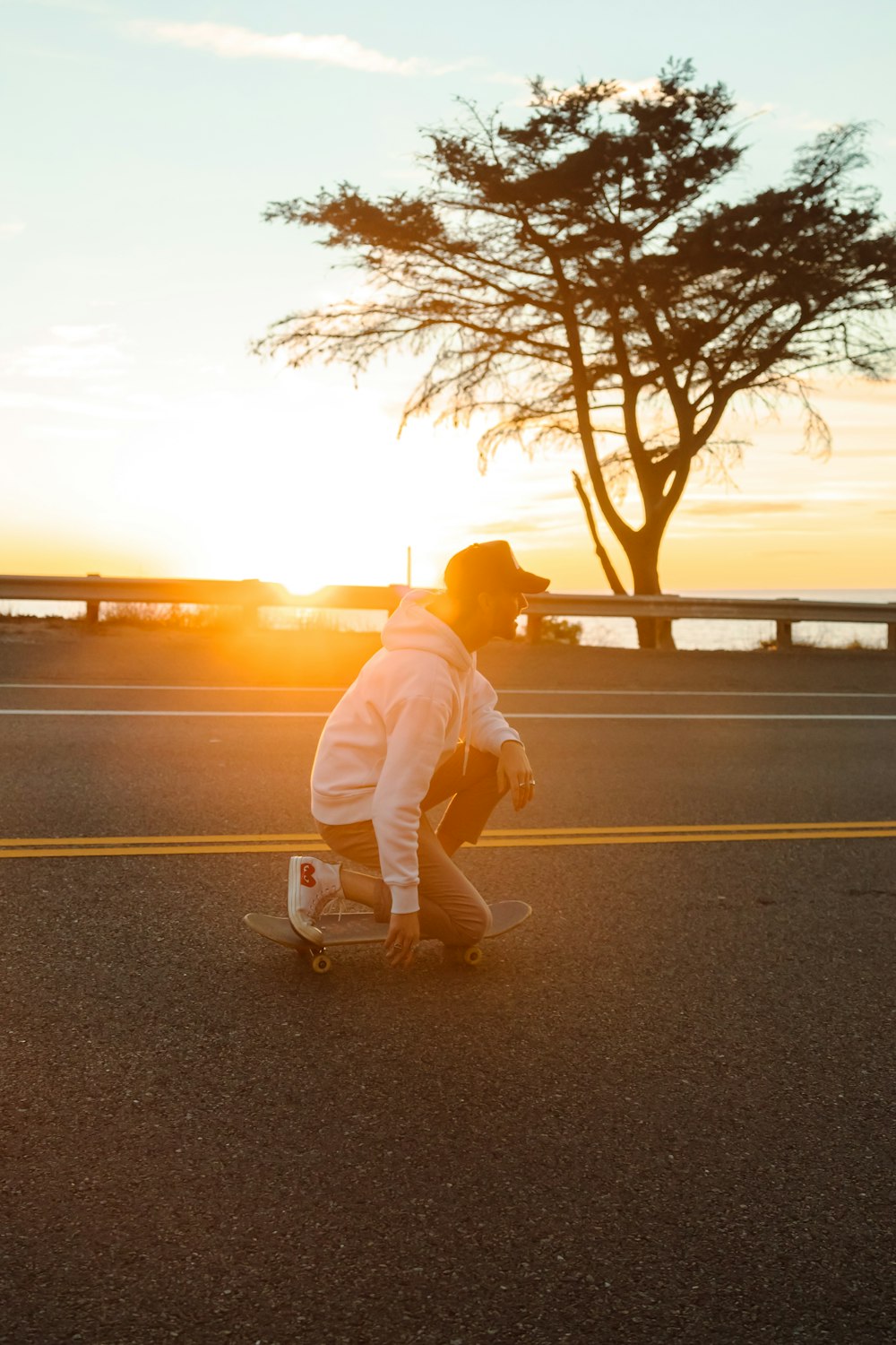 a man riding a skateboard down a street