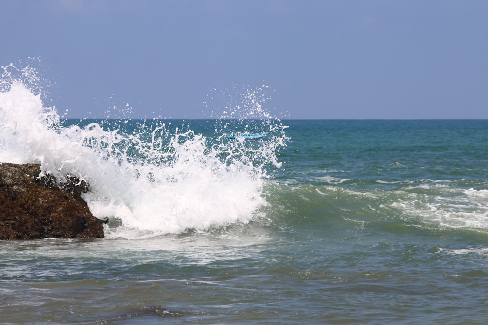 a person riding a surfboard on a wave in the ocean