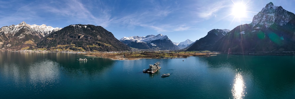 a group of boats floating on top of a lake