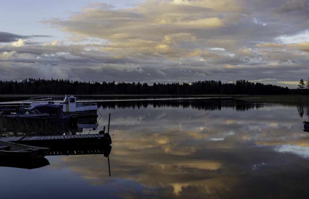 a group of boats that are sitting in the water