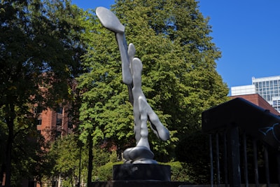 Finished fiberglass and stainless steel sculptures displayed outdoors in natural light