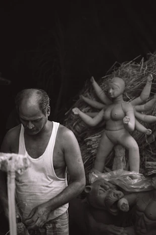 Artistic custom sculptures in various stages of completion on a studio workbench.