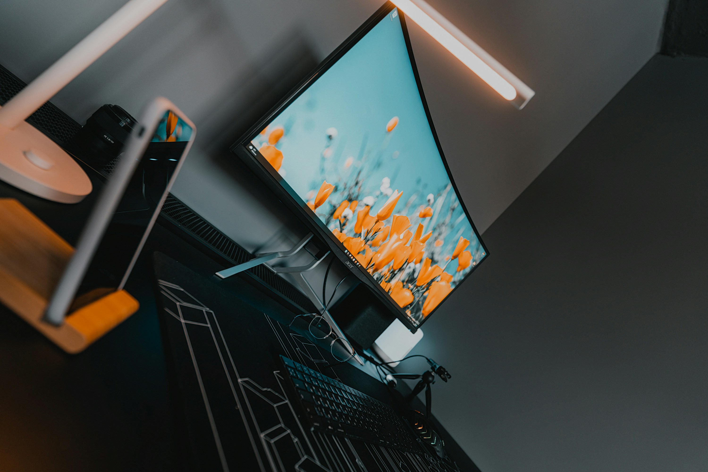 a flat screen tv sitting on top of a desk