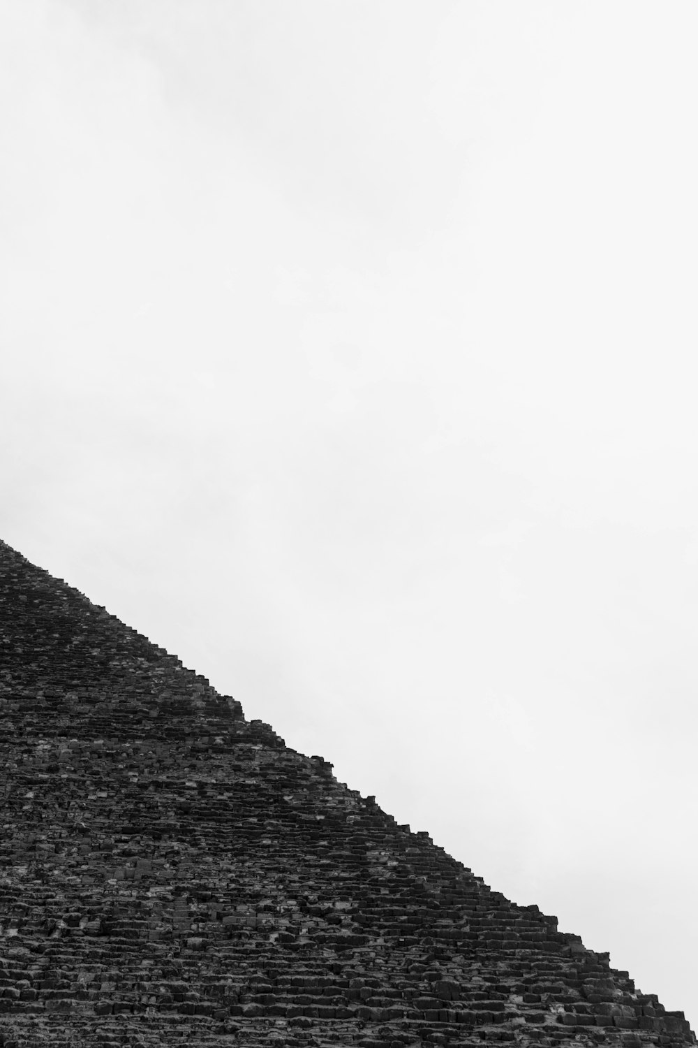 a black and white photo of a pyramid