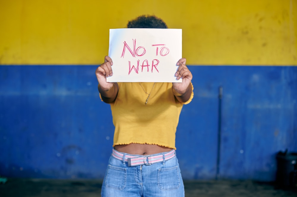 a person holding a sign