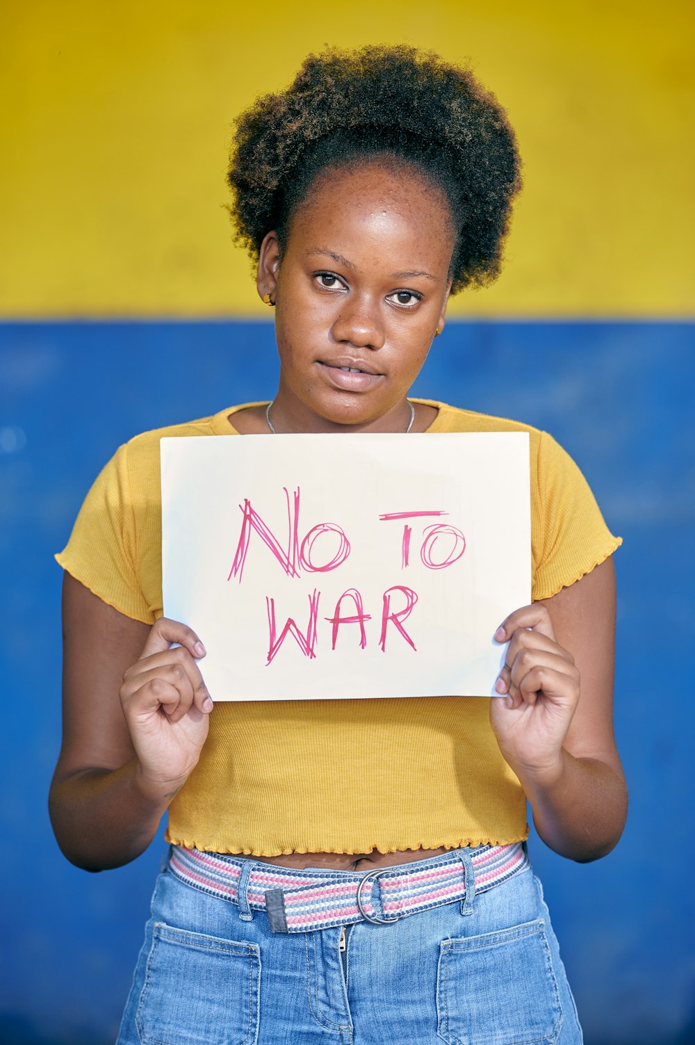 a young man holding a sign