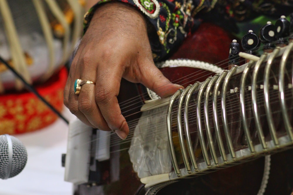 a close up of a person playing a musical instrument