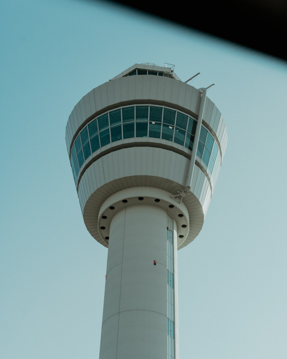 a tall white tower with a sky background