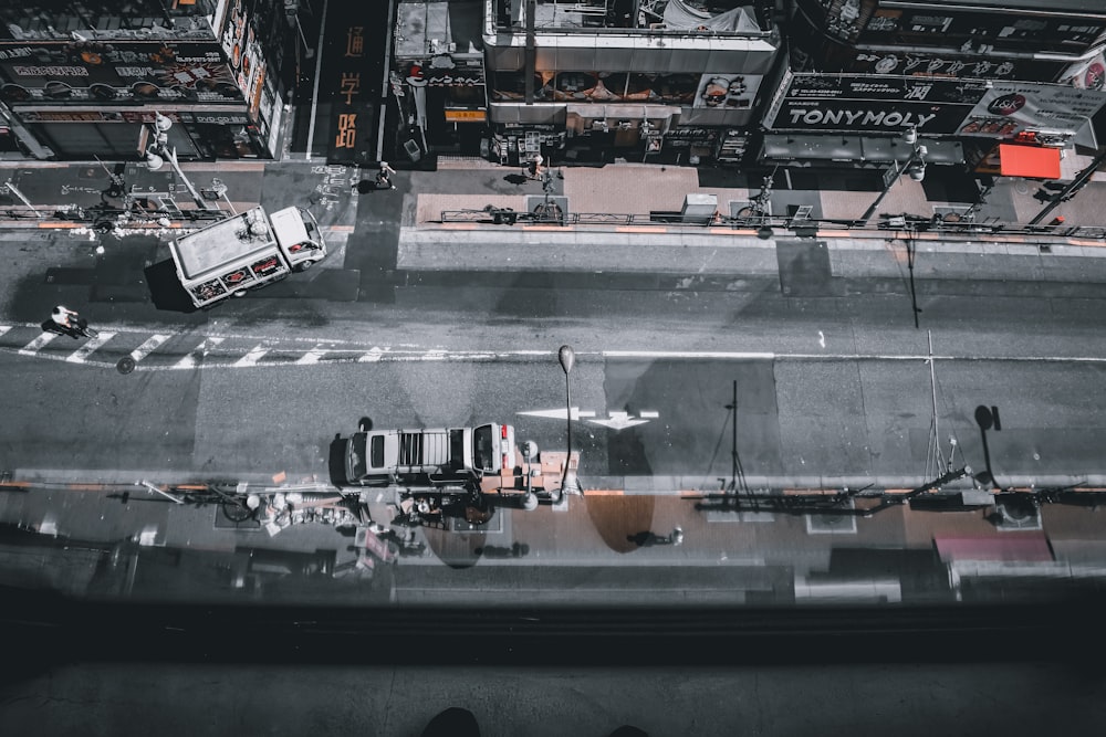 an aerial view of a city street with a truck
