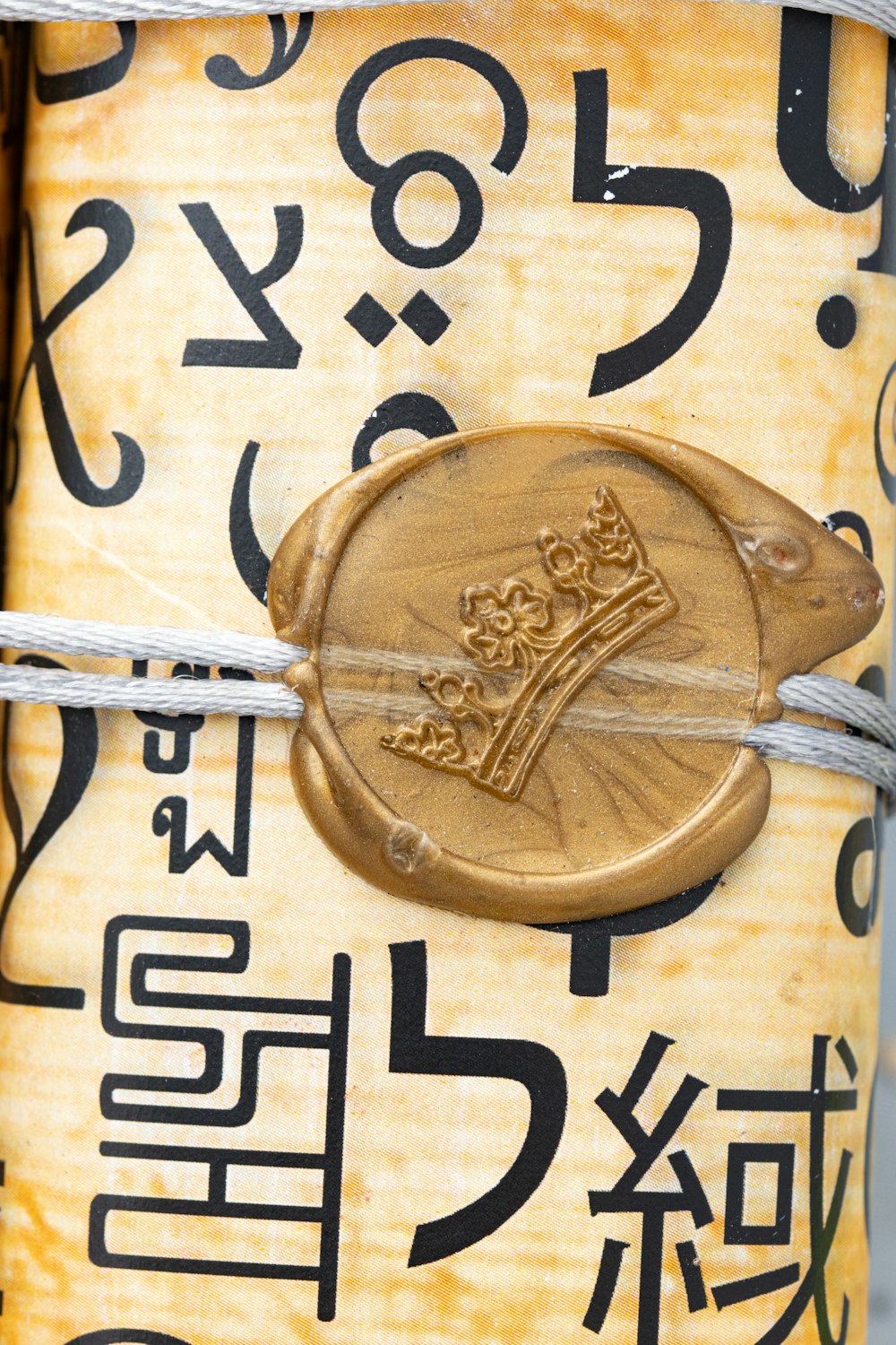 a close up of a metal object with writing on it