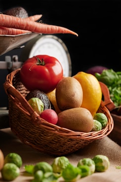 a basket filled with lots of different fruits and vegetables