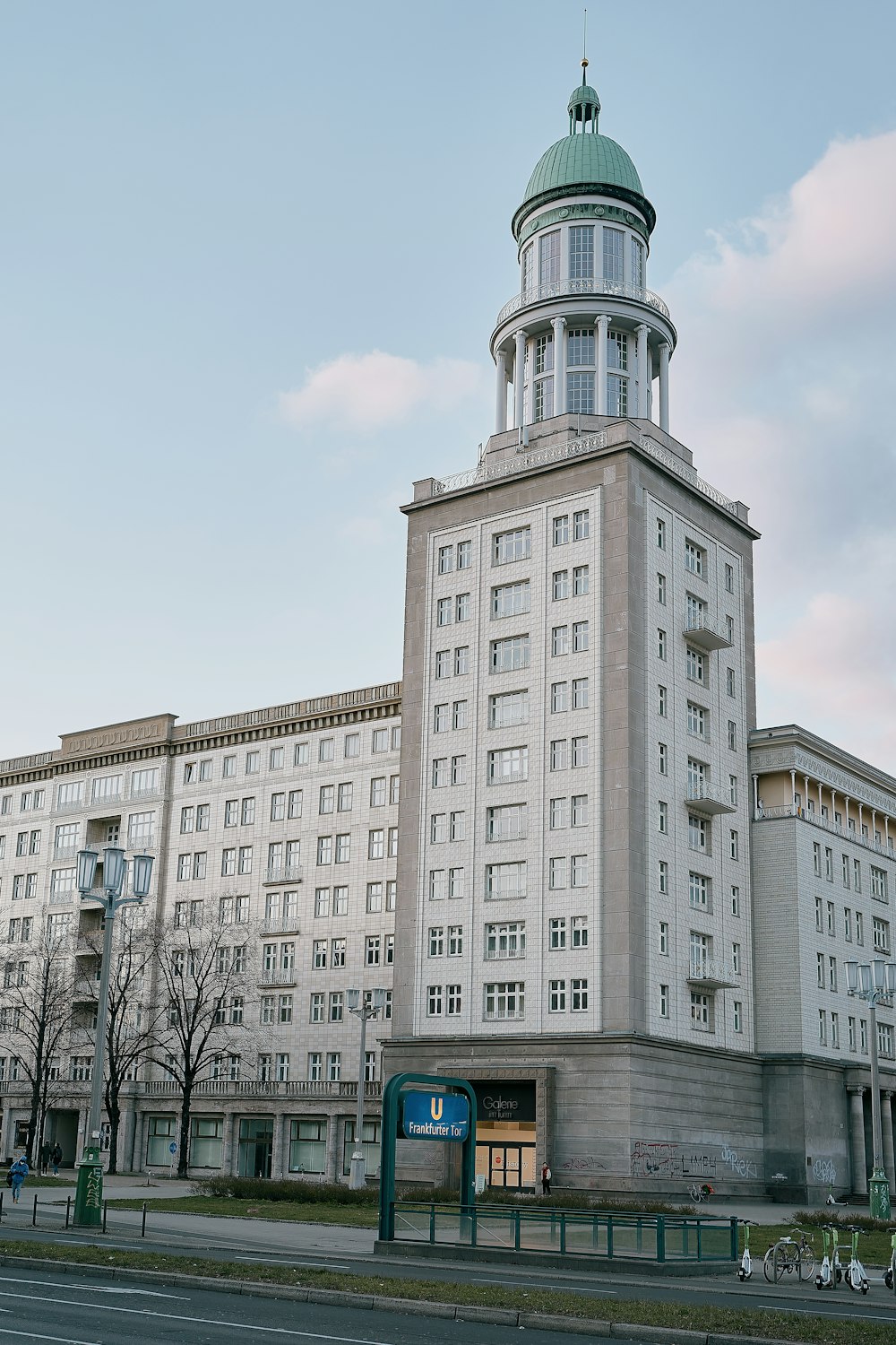 a large white building with a clock tower