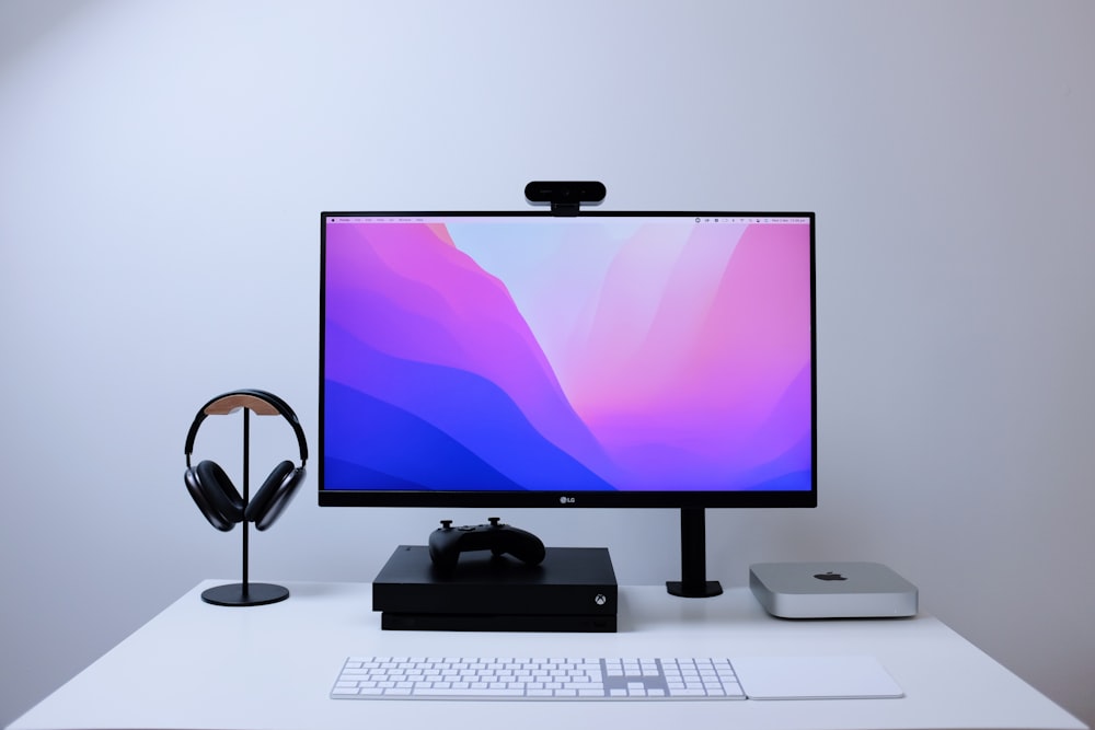 a computer monitor sitting on top of a desk