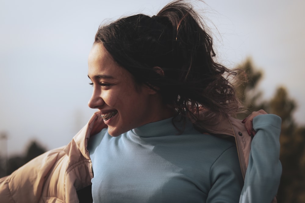 a woman with her hair in the wind