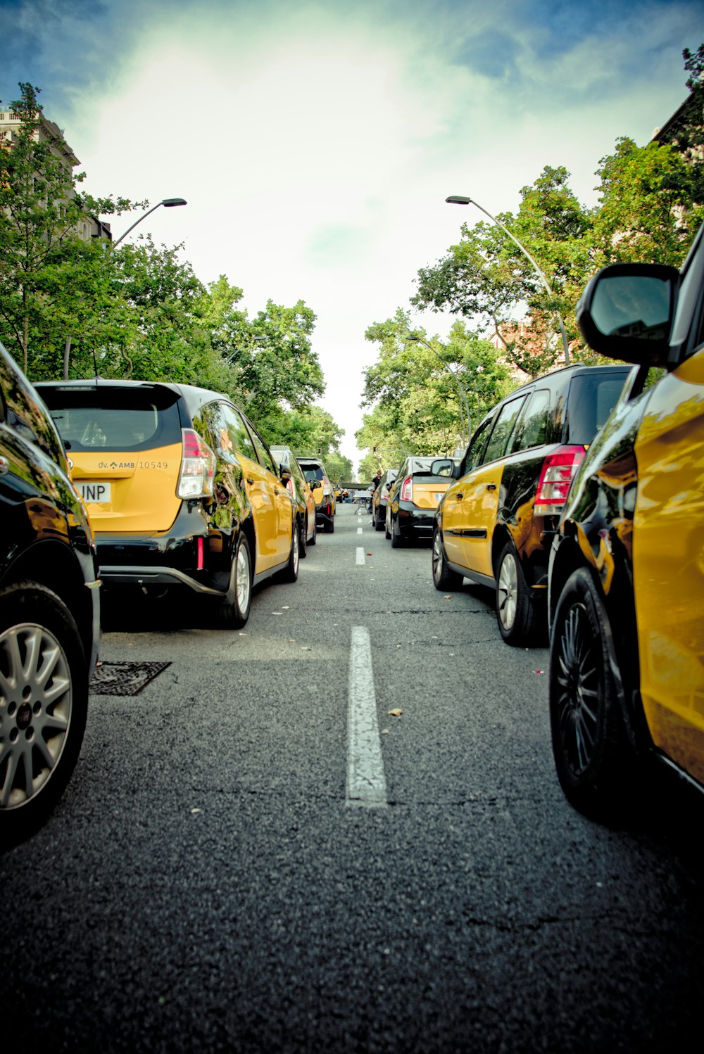 a street filled with lots of different colored cars