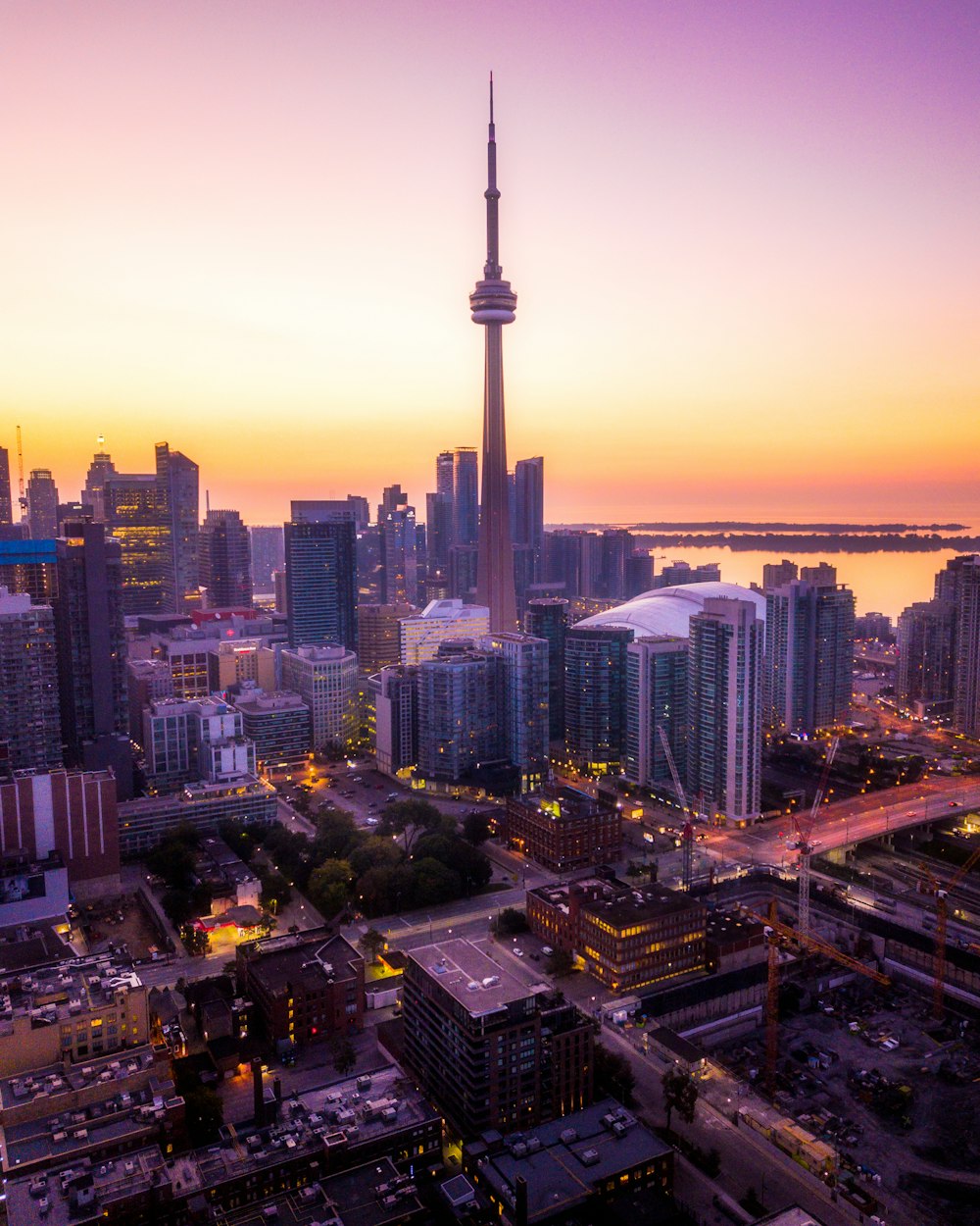 a view of a city skyline at sunset