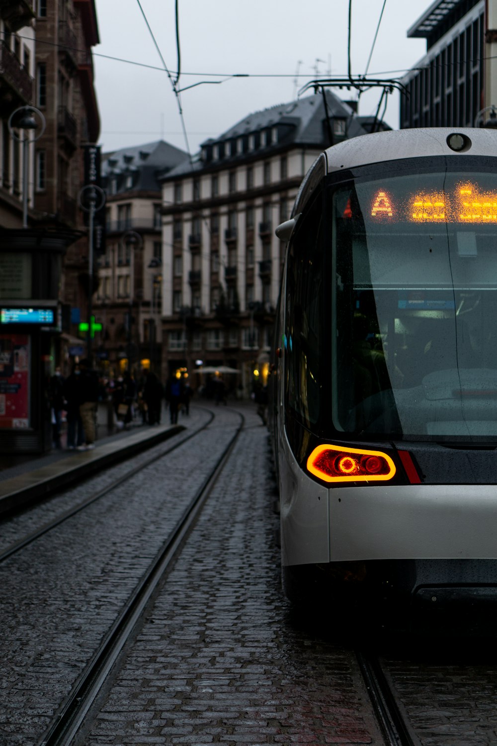 a train on a track in a city