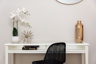 An elegant workspace featuring minimalist design elements with warm ivory tones and subtle champagne gold accents.