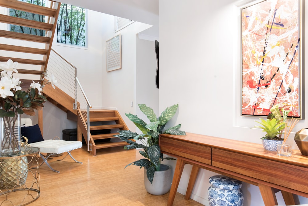 a living room filled with furniture and a staircase