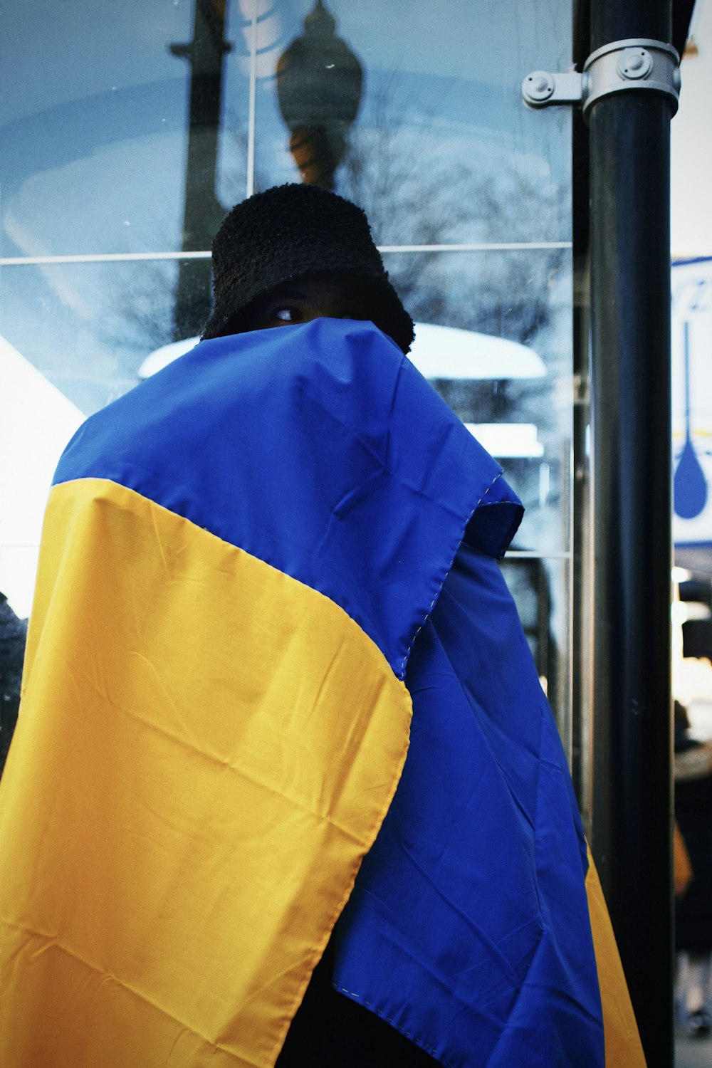 a person with a blue and yellow jacket on