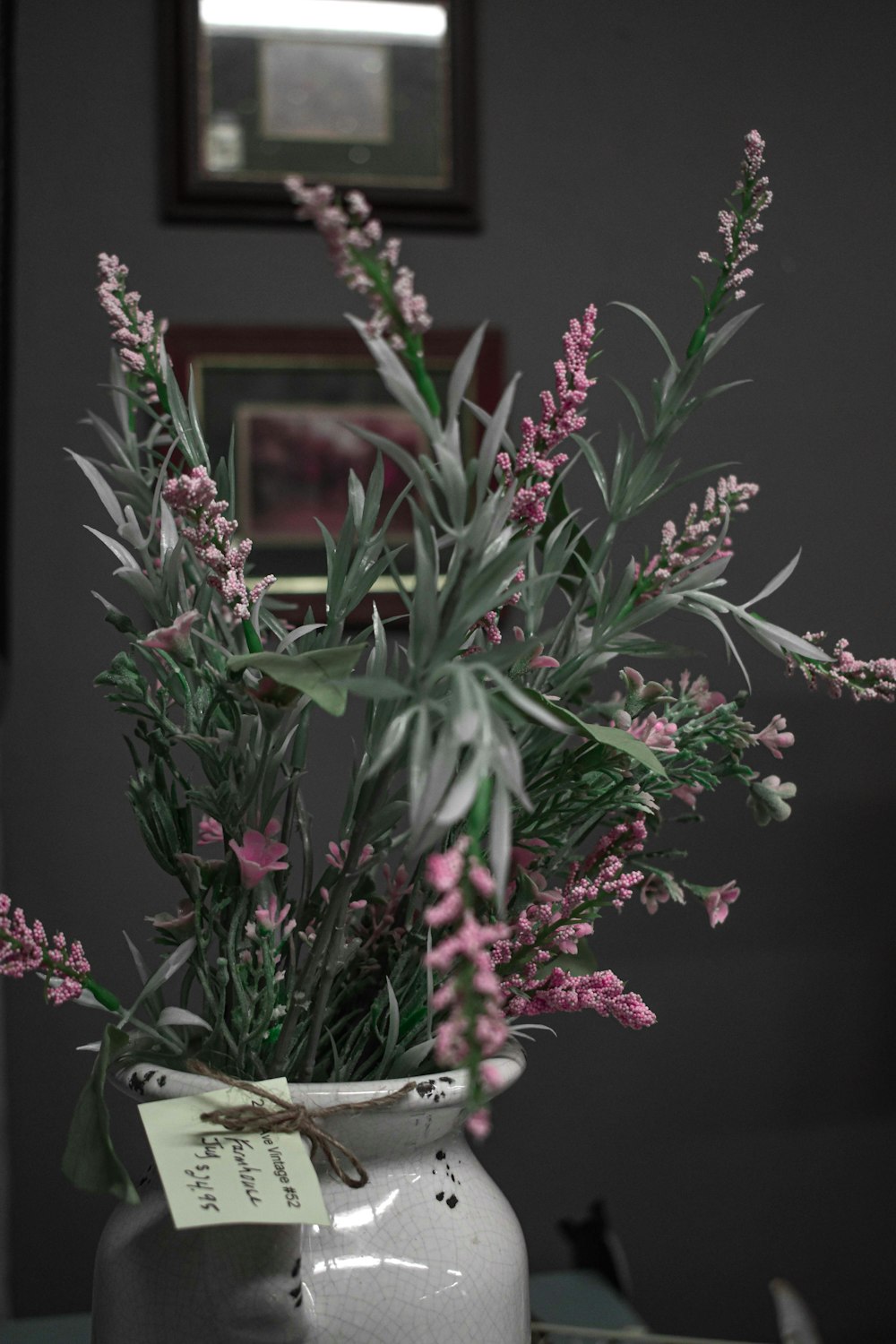 a vase filled with flowers sitting on top of a table