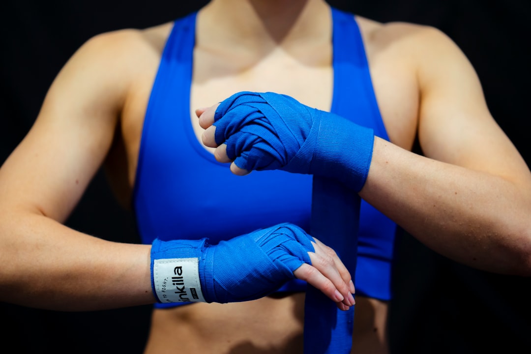 a close up of a person wearing blue gloves