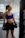 Portrait of a focused female athlete training in an industrial-style gym with minimalist design.