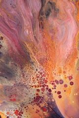 A vibrant alcohol ink artwork on birchwood.