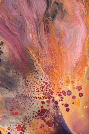 A vibrant alcohol ink artwork on birchwood.