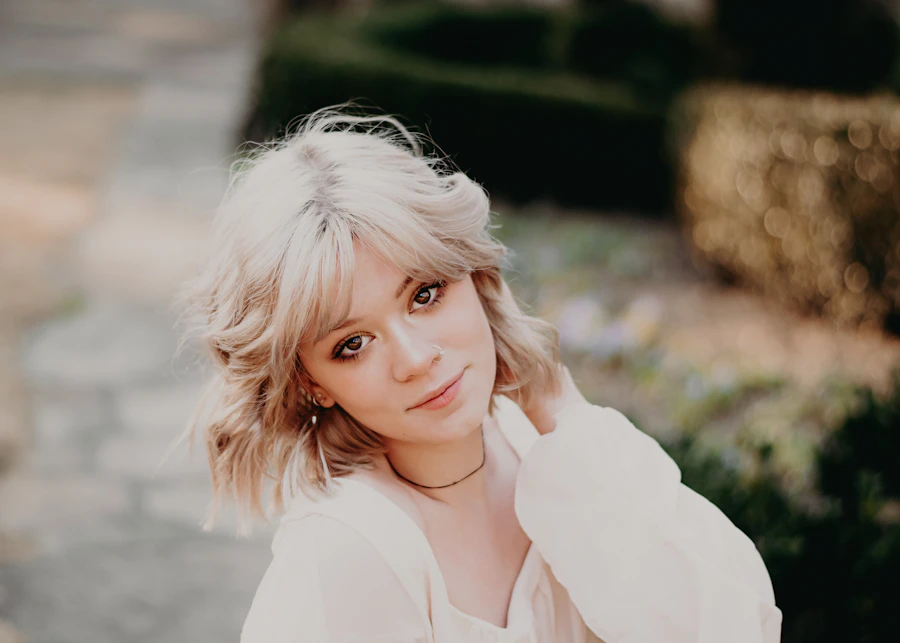a woman in a white shirt posing for a picture