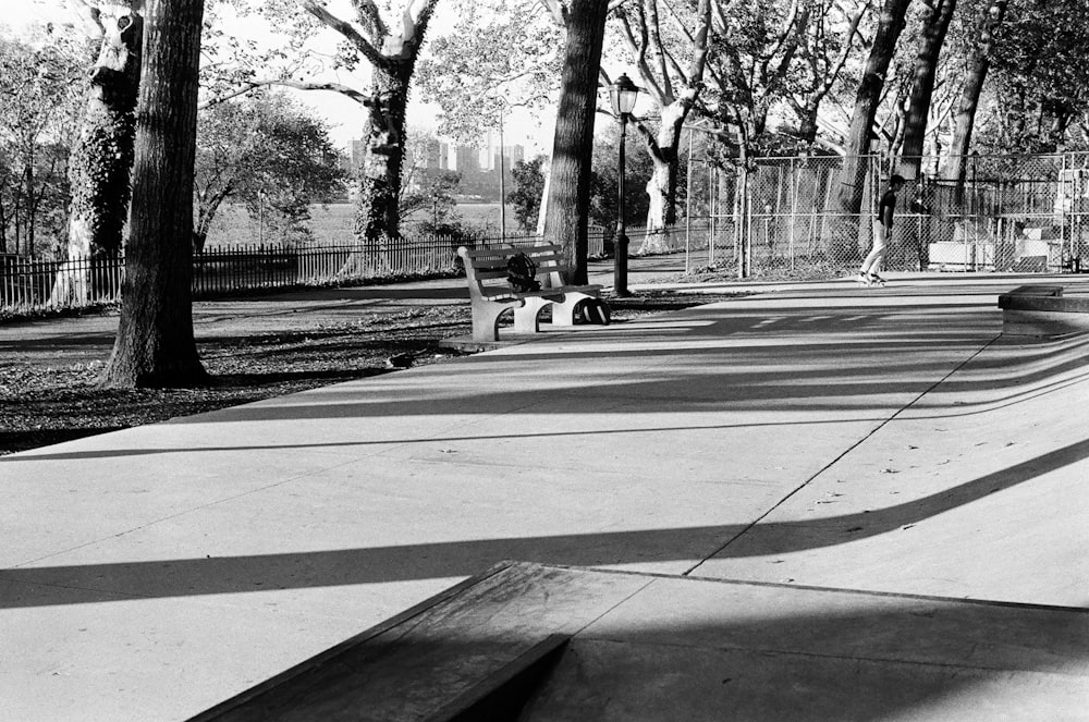 a black and white photo of a skateboarder doing a trick