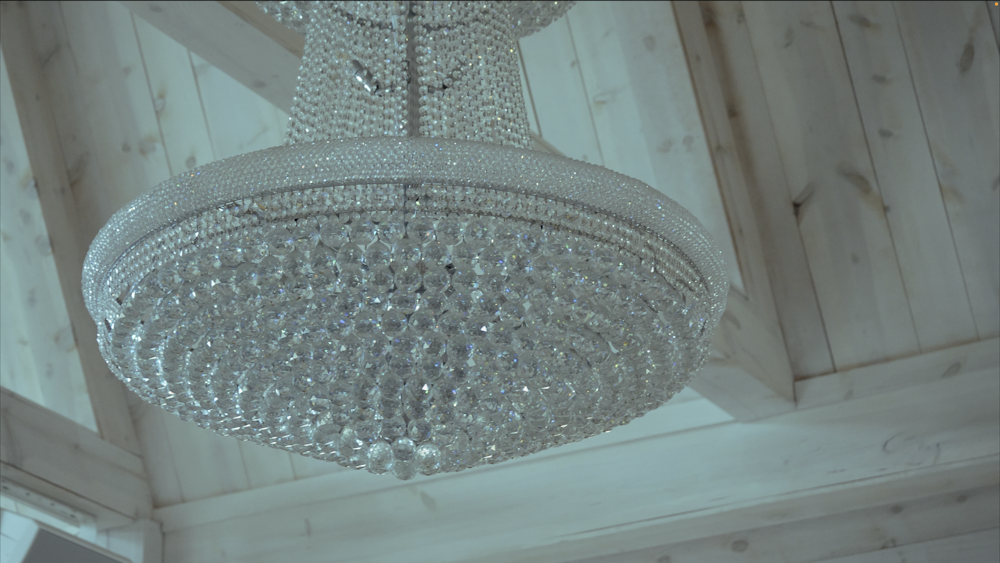 a chandelier hanging from the ceiling of a room