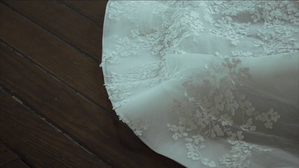 a close up of a dress on a wooden floor