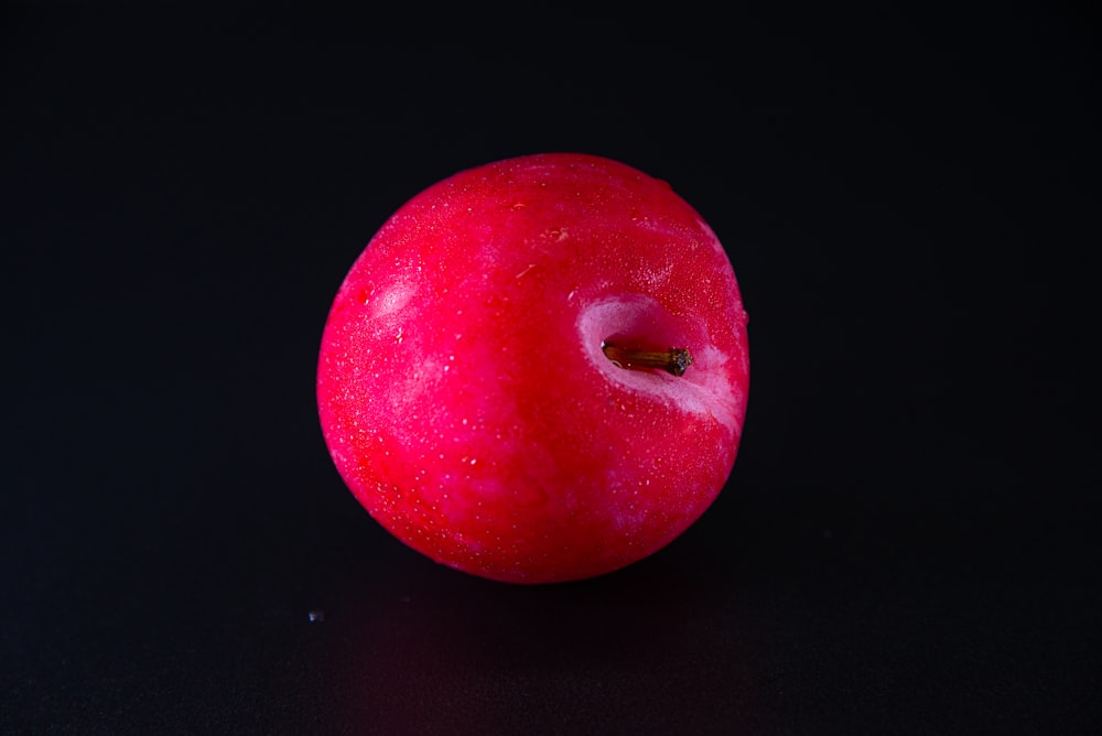 a red apple with a bite taken out of it