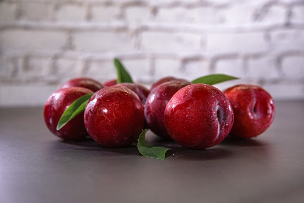 a group of apples sitting on top of a table